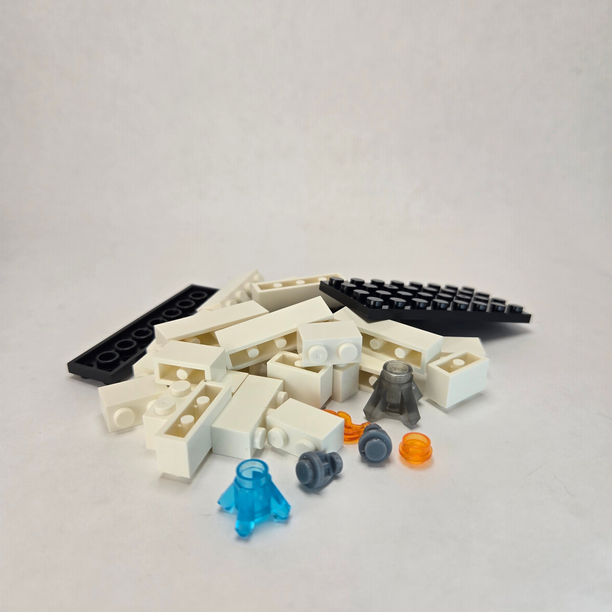 Unassembled single fire sprinkler demo kit displaying all block pieces and unique sprinkler elements compatible with popular building block brands.