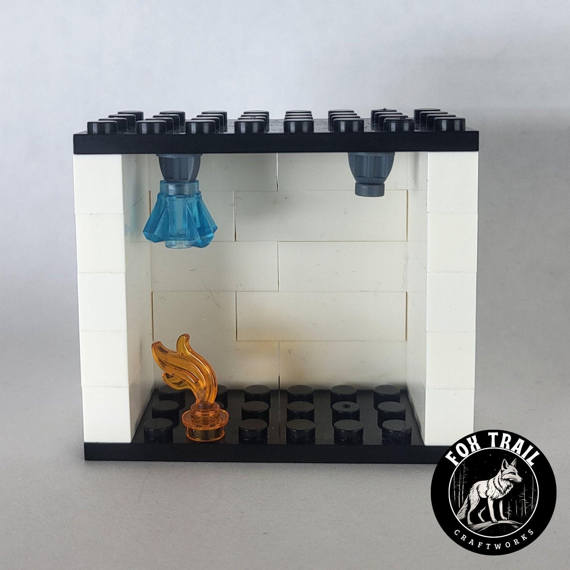 Single fire sprinkler demo kit built from blocks, featuring two exclusive sprinkler elements — one with flame underneath and a blue crystal drop showing activation.