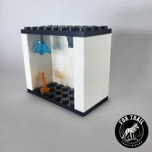 Right‑side view of single fire sprinkler demo kit built from blocks, highlighting two exclusive sprinkler elements and realistic flame detail.