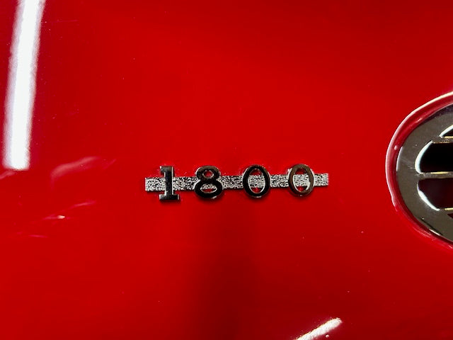 MGA 1800 custom emblem installed on side vent of classic MGA, illustrating accurate fit and period‑correct style for restorations.
