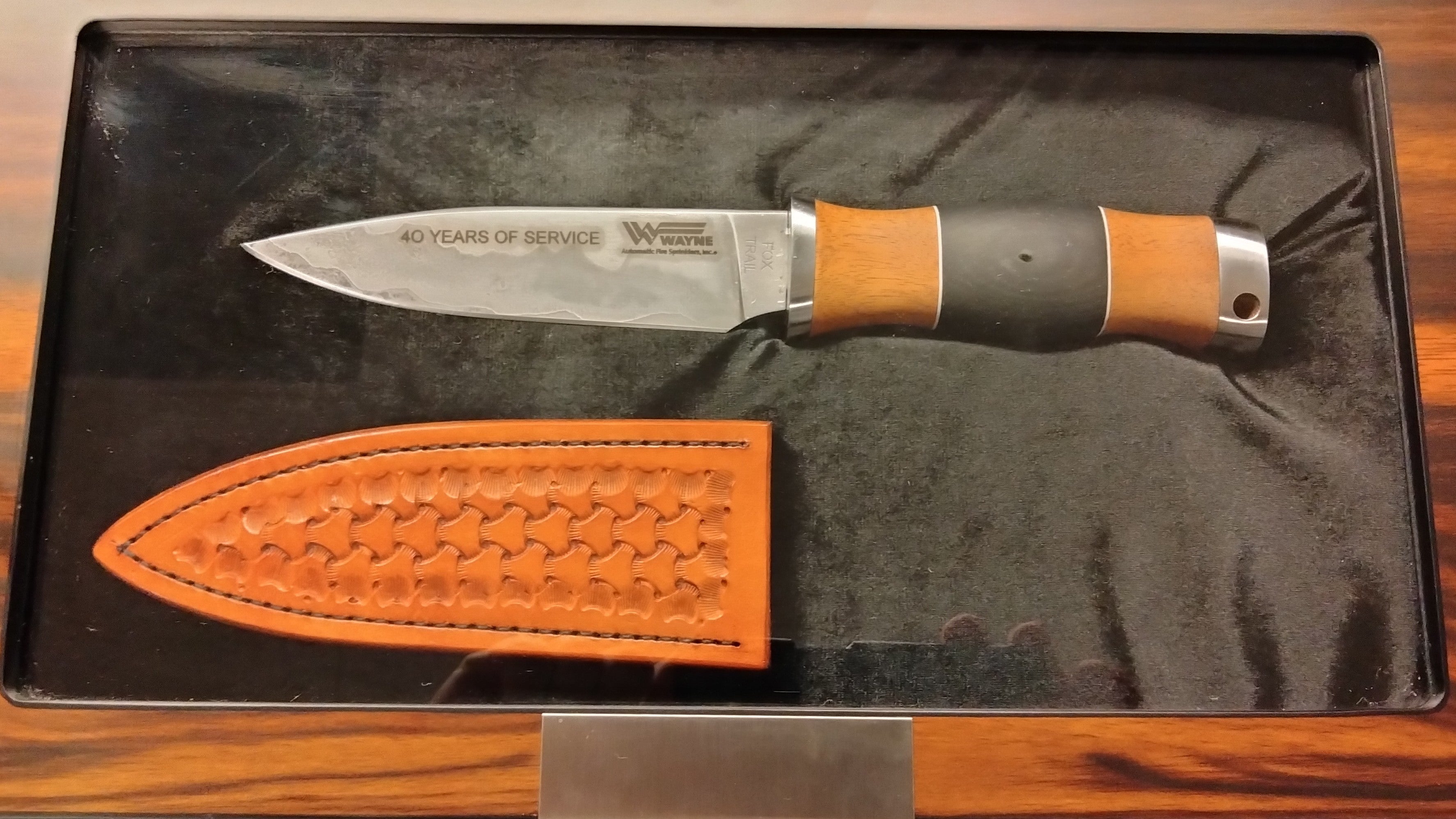 Load video: Video of a hand-forged Go Mai custom knife made from historic railroad spikes and signature micarta, created to honor 40 years of service.