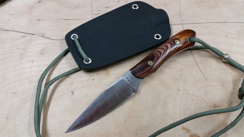 Neck knife with 440C stainless blade and cocobolo handle shifting purple to red, paired with custom black Kydex sheath and paracord lanyard with bead. Handmade by Fox Trail Craftworks, compact design for everyday carry or collectors.