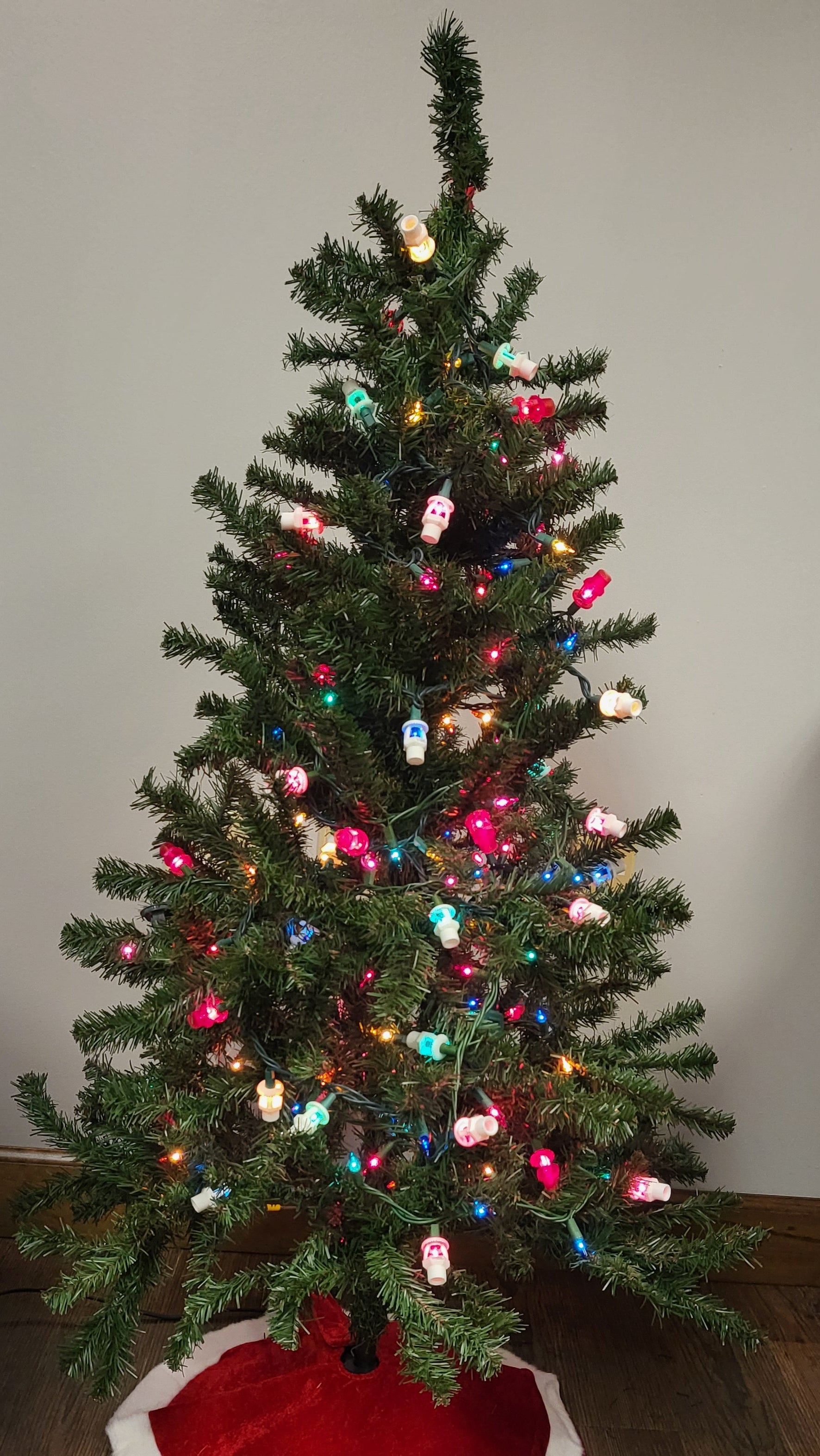 Fire sprinkler light covers on Christmas tree—daytime.