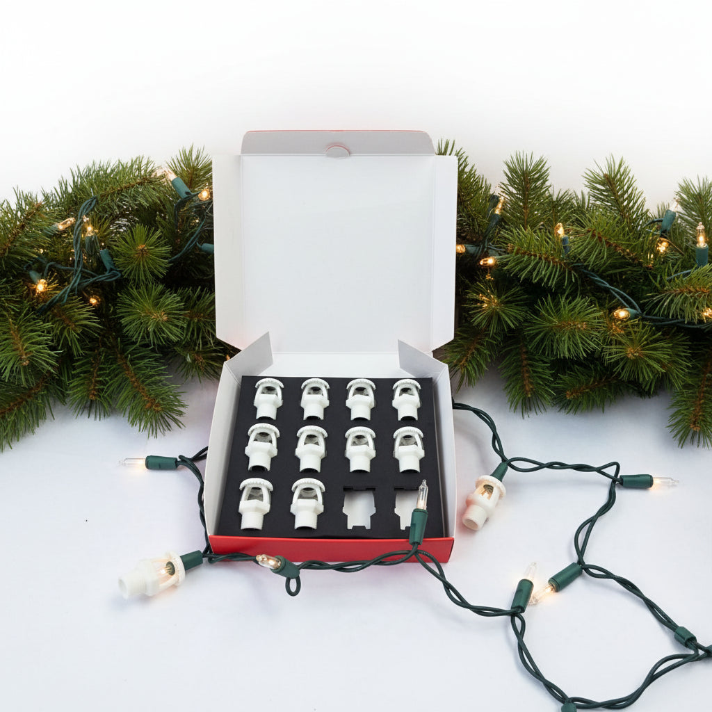 Fire sprinkler string light covers displayed in box with mini-light strand and greenery.