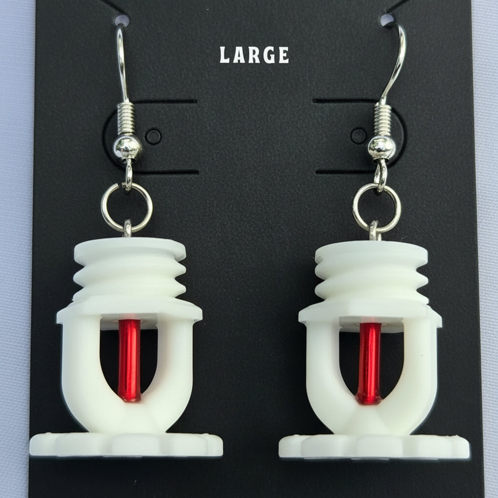 Pair of white fire sprinkler earrings with red frangible bulb on a black card labeled 'LARGE'.